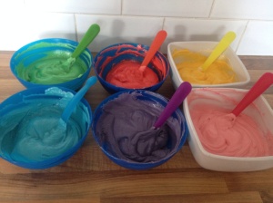 The cake mixture all divided up, coloured using the Walton gel colours and ready to bake in the oven. And Yes, I did use colour coordinated spoons! 😂